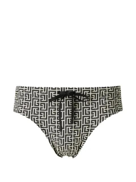 monogram-print swimming trunks by BALMAIN