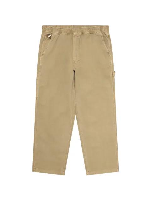AAPENOW Moonface logo-patch trousers by BAPE