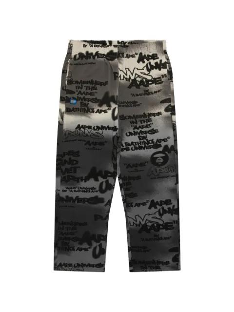 Aapeunvs graffiti-print track pants by BAPE