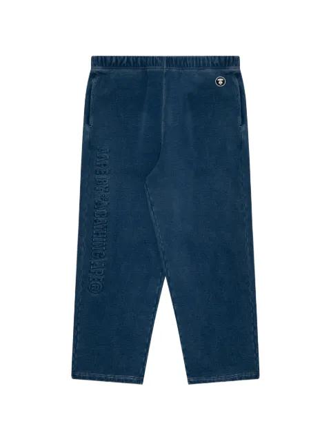 Moonface embossed-logo trousers by BAPE