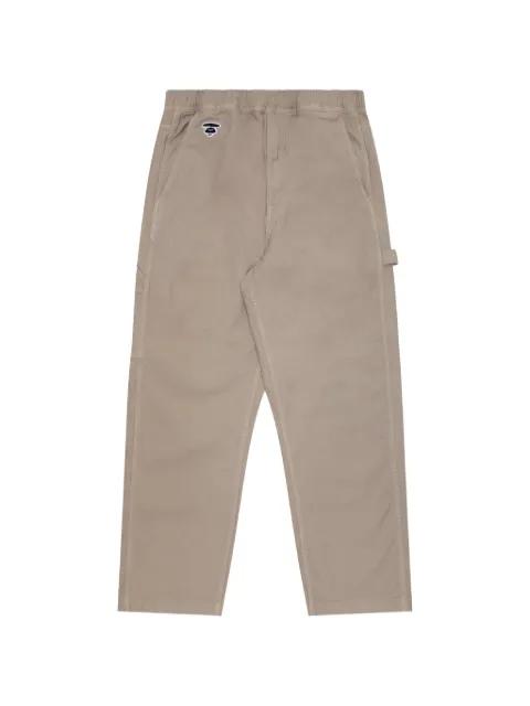 Moonface embroidered carpenter trousers by BAPE