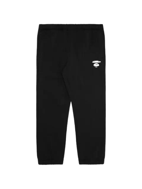 Moonface logo-print trousers by BAPE