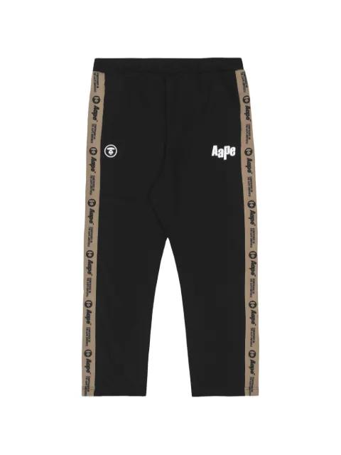 Moonface logo-tape track pants by BAPE