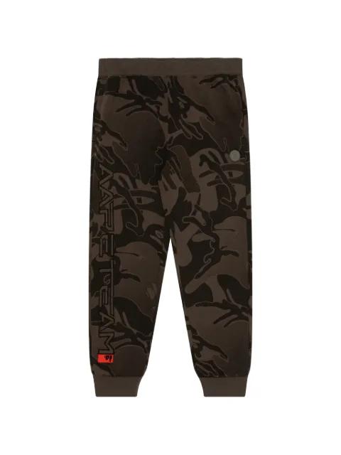 Moonface-patch camo track pants by BAPE