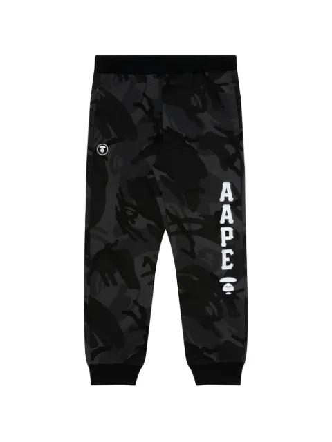 Moonface-patch camo track pants by BAPE