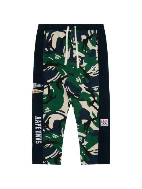 Moonface-patch camouflage track pants by BAPE