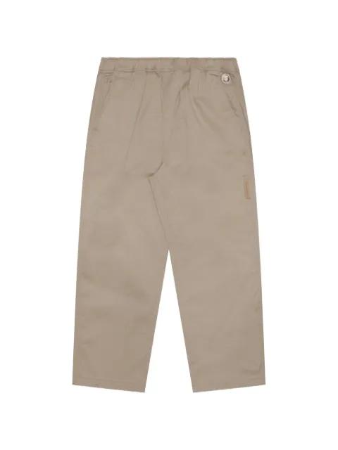 Moonface-patch drawstring chino pants by BAPE