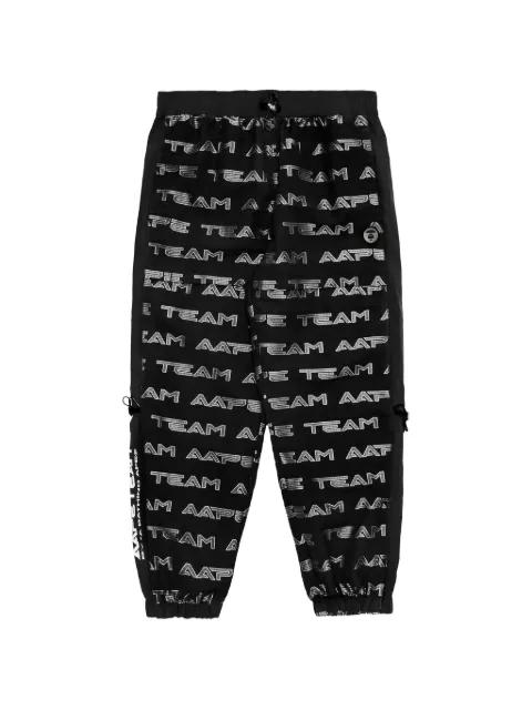 Moonface-patch monogram track pants by BAPE