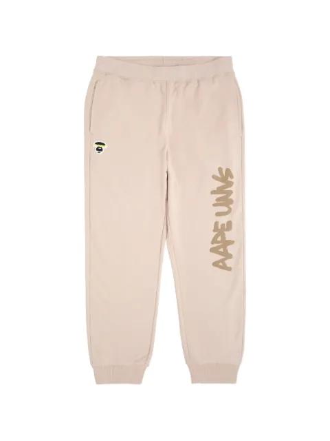Moonface patch sweatpants by BAPE