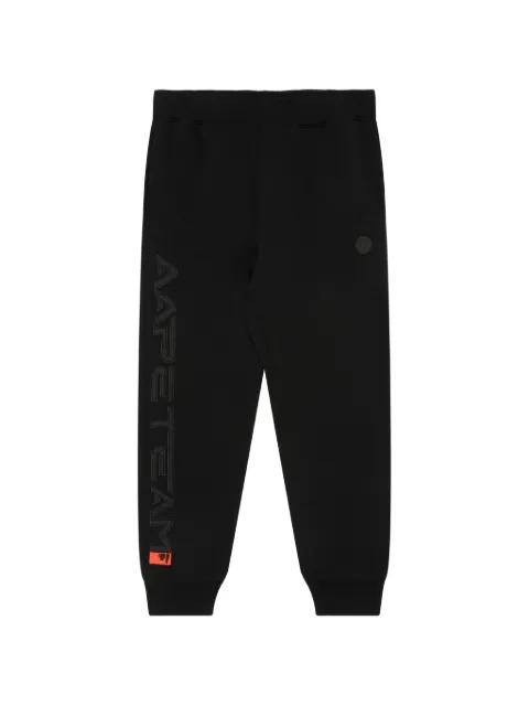 Moonface-patch track pants by BAPE