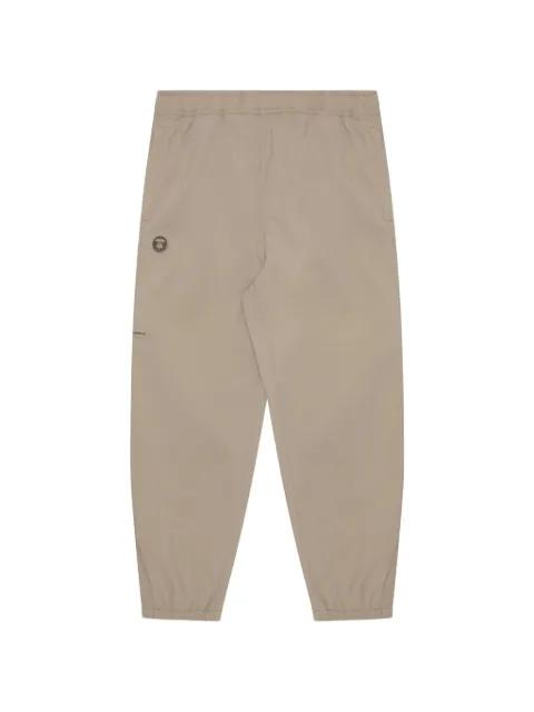 Moonface-patch track pants by BAPE