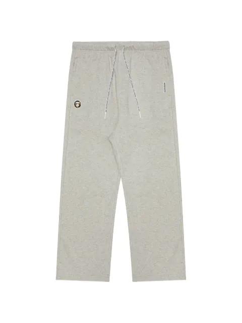 Moonface patch track pants by BAPE