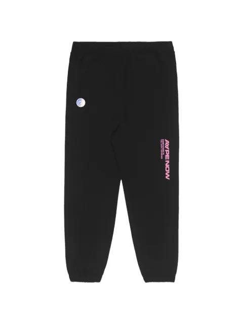 Moonface printed track pants by BAPE