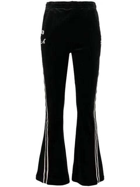 logo-patch flared trousers by BAPE
