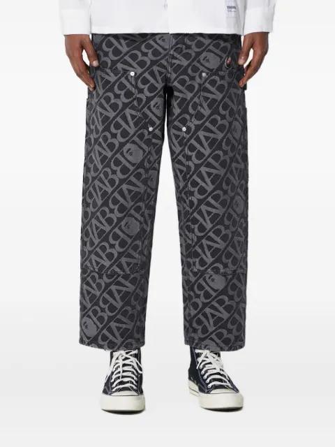 logo-pattern carpenter jeans by BAPE