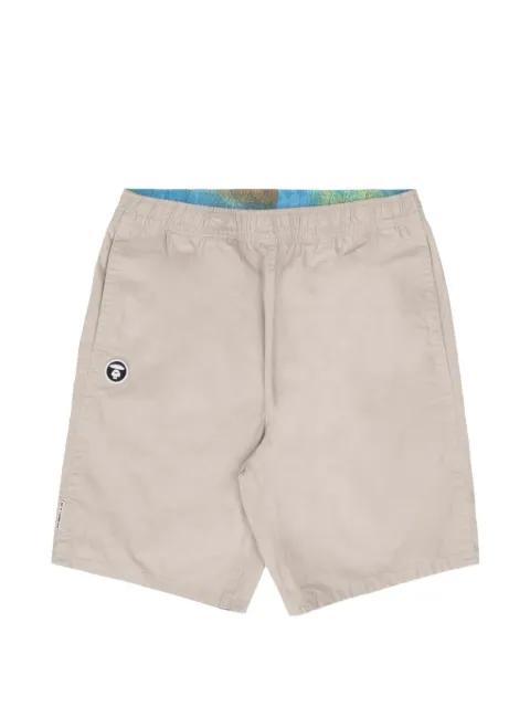 moonface embroidered reversible shorts by BAPE