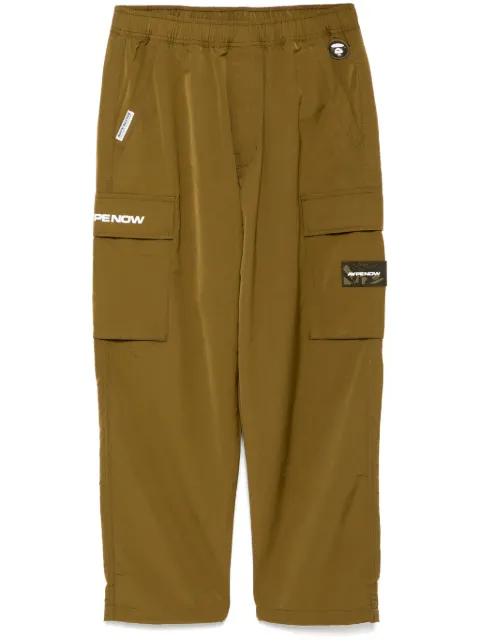moonface-logo cargo trousers by BAPE