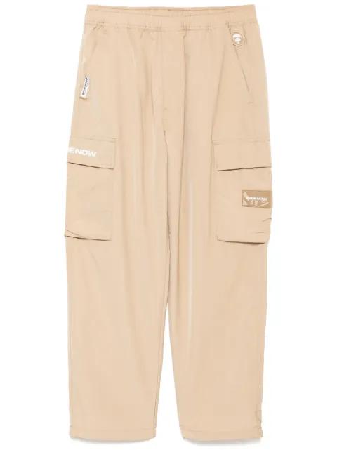 moonface-logo cargo trousers by BAPE