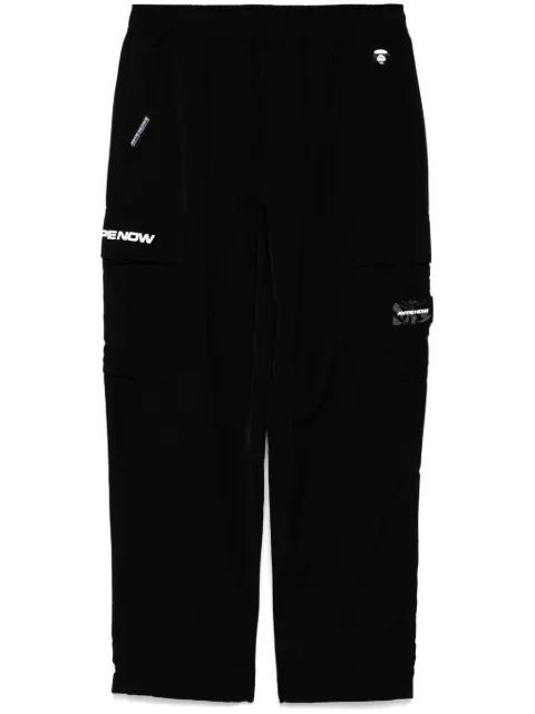 moonface-logo cargo trousers by BAPE