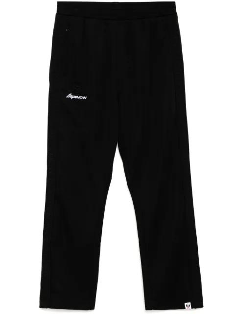 moonface-logo track pants by BAPE