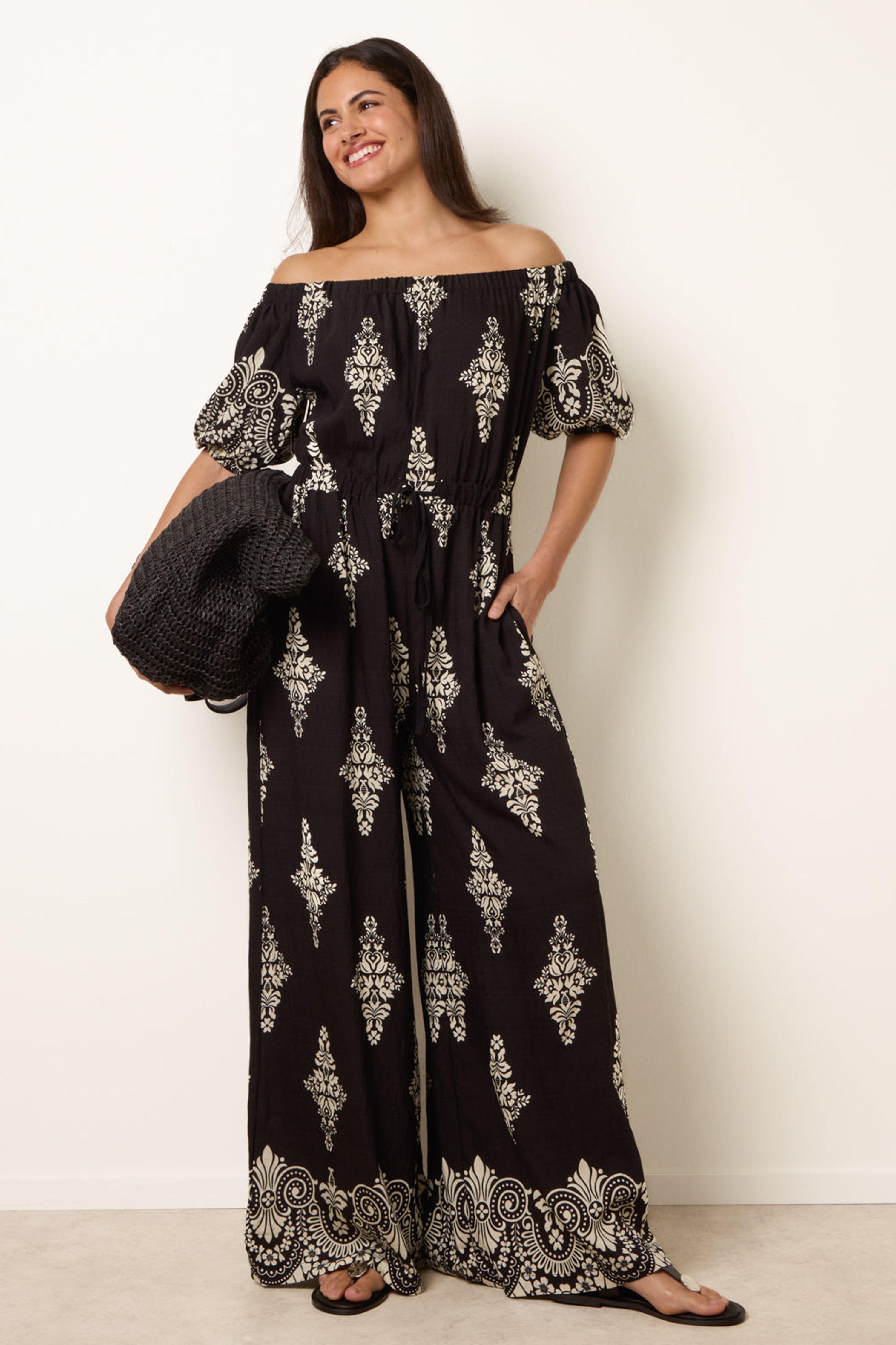 Black Printed Off Shoulder Jumpsuit by BLUE VANILLA