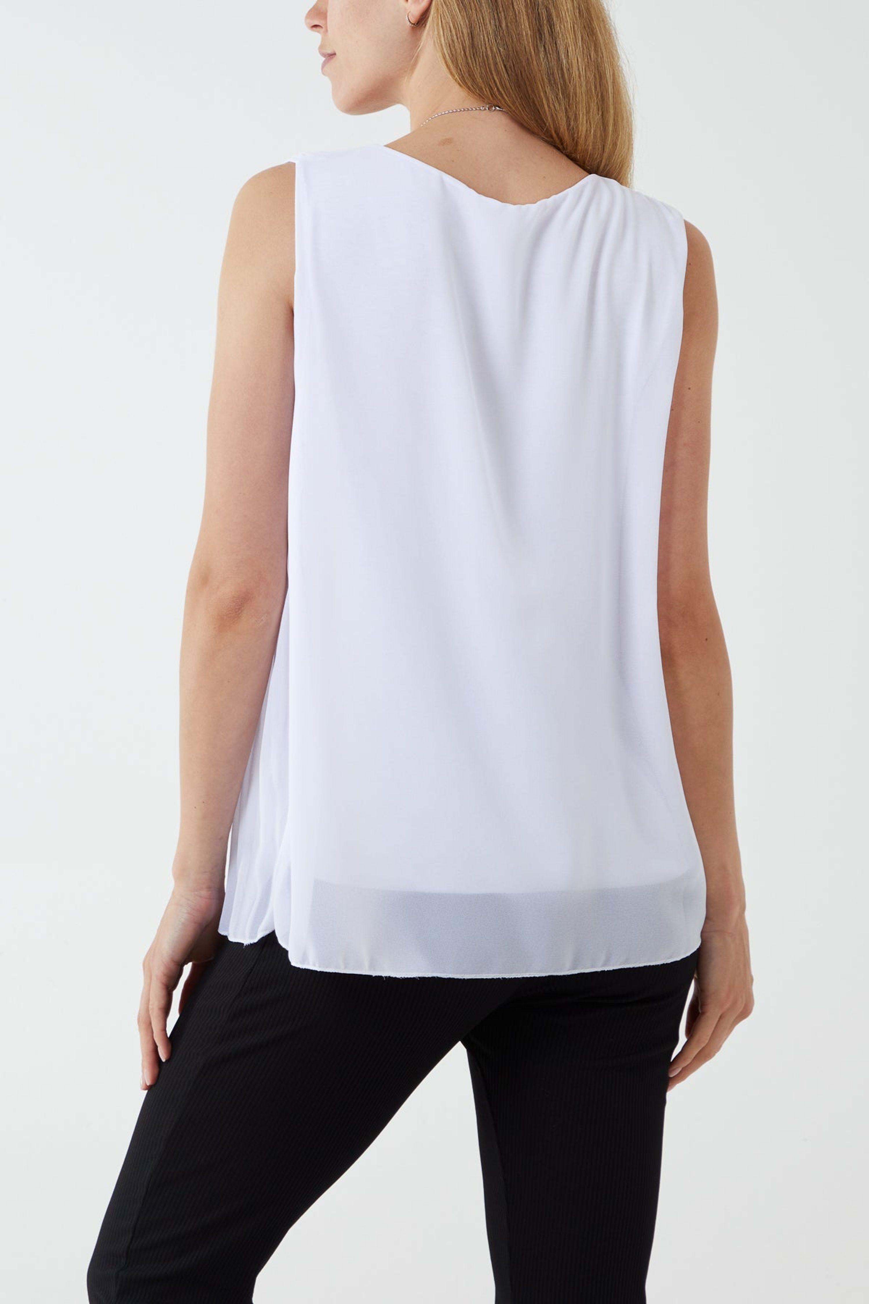 Ivory Sleeveless Pleated Top by BLUE VANILLA