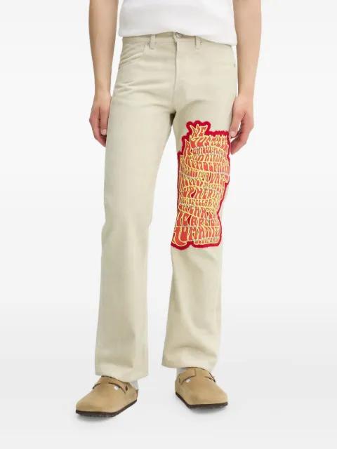 embroidered-studded jeans by BLUEMARBLE