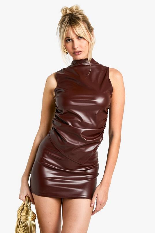 Faux Leather Sleeveless High Neck Top And Mini Skirt Set by BOOHOO Faux Leather Sleeveless High Neck Top And Mini Skirt Set by BOOHOO