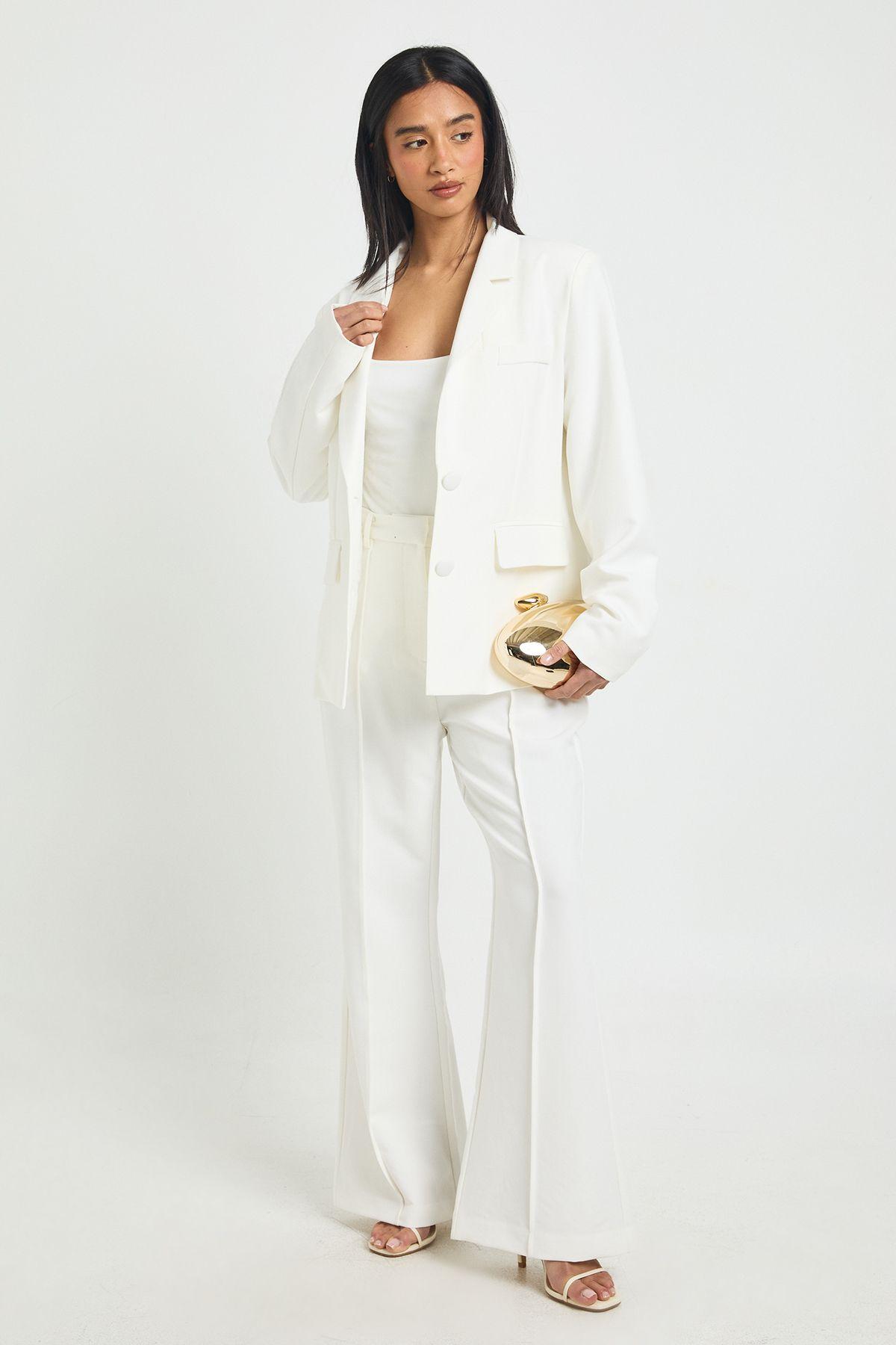 Petite Essential Flare Leg Tailored Trousers by BOOHOO