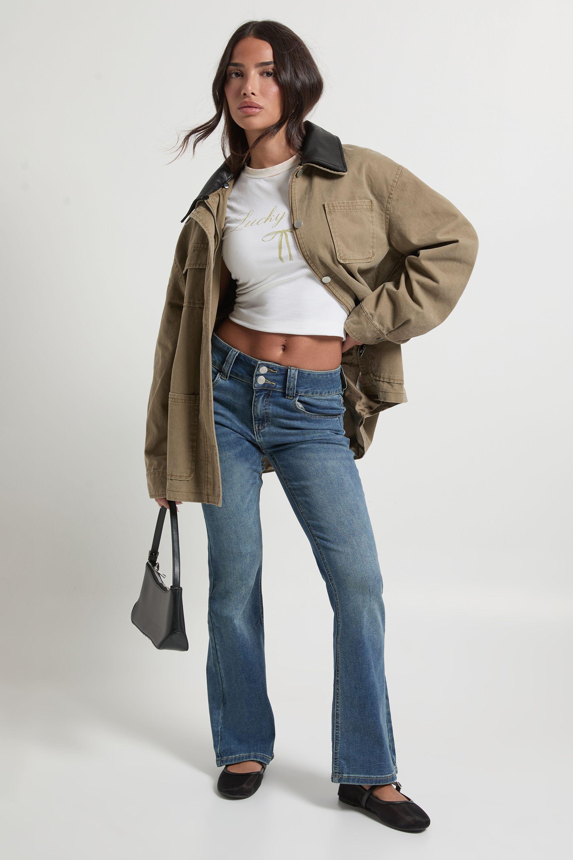 Petite Low Waist Double Button Flared Jean by BOOHOO