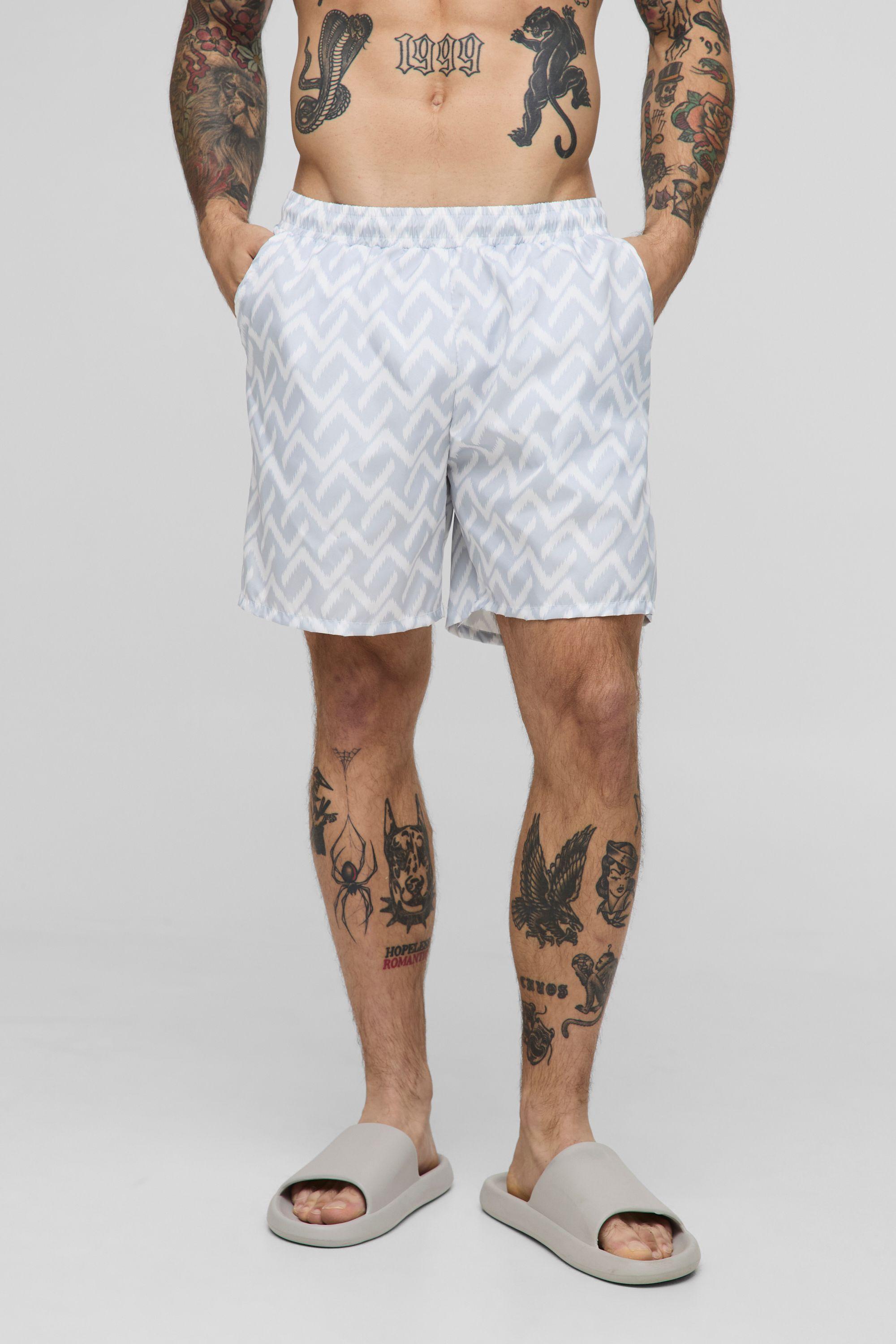 Abstract Pattern Printed Mid Length Swim Short by BOOHOOMAN Abstract Pattern Printed Mid Length Swim Short by BOOHOOMAN