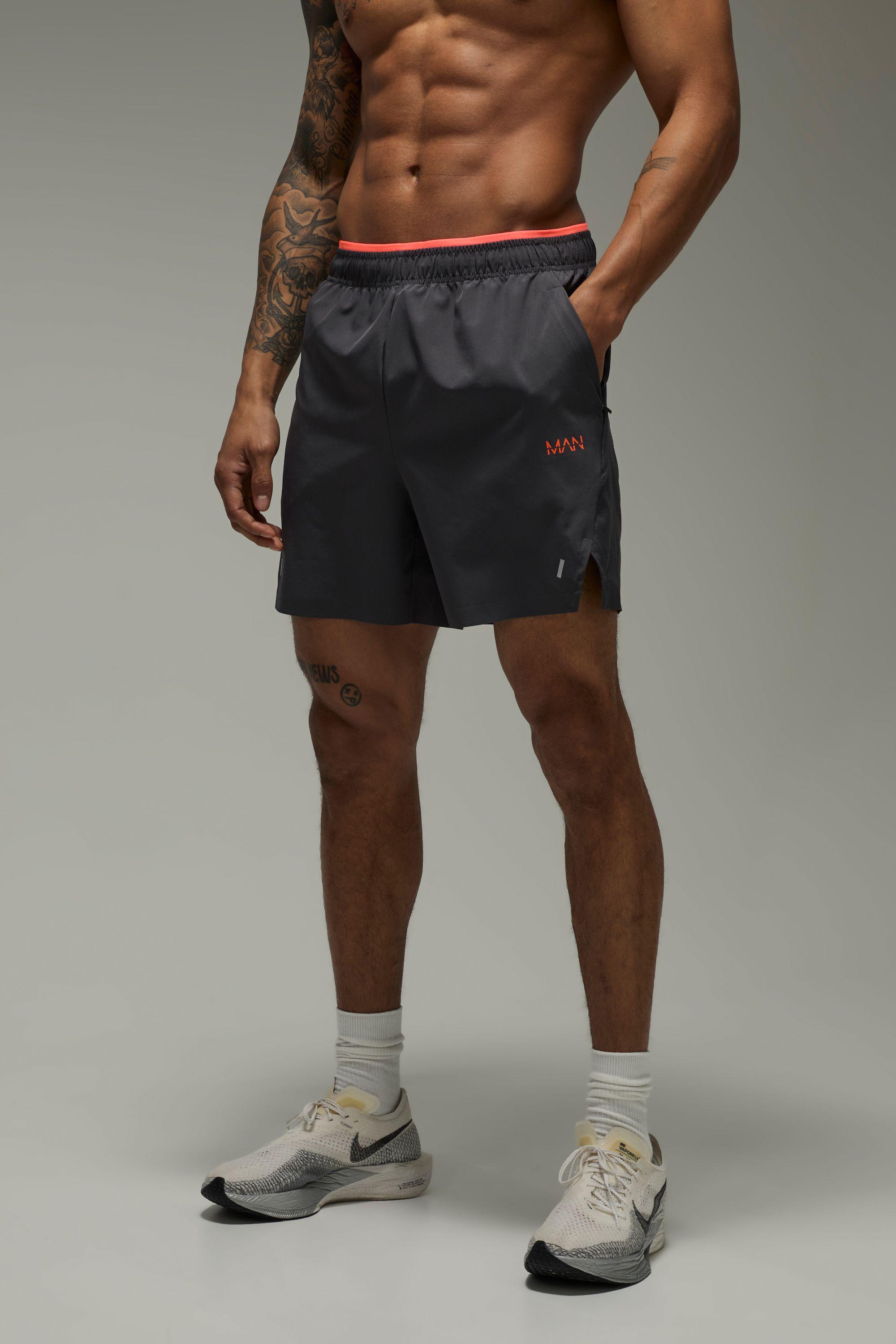 Man Active Perforated 5inch Neon Shorts by BOOHOOMAN