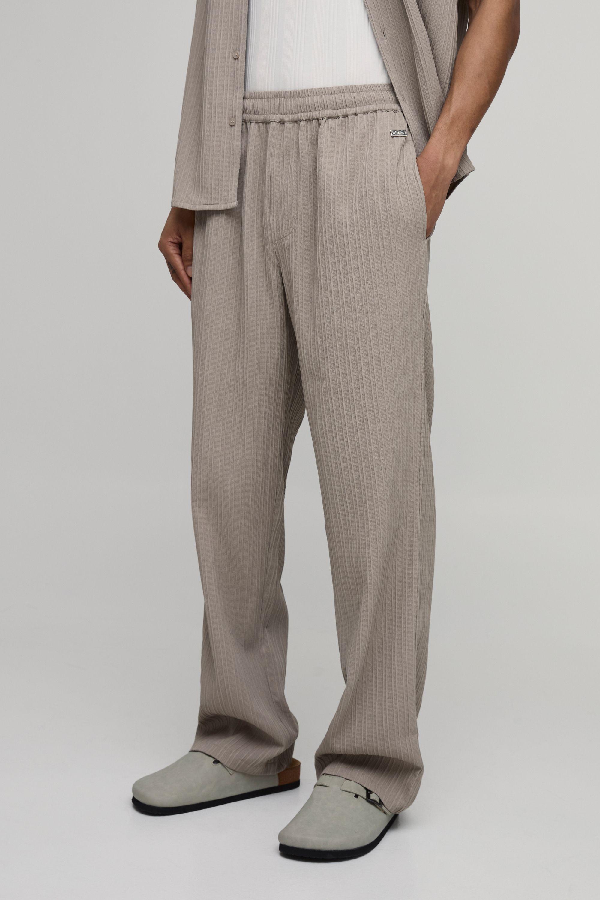 Relaxed Fit Irregular Pleat Texture Trousers by BOOHOOMAN Relaxed Fit Irregular Pleat Texture Trousers by BOOHOOMAN