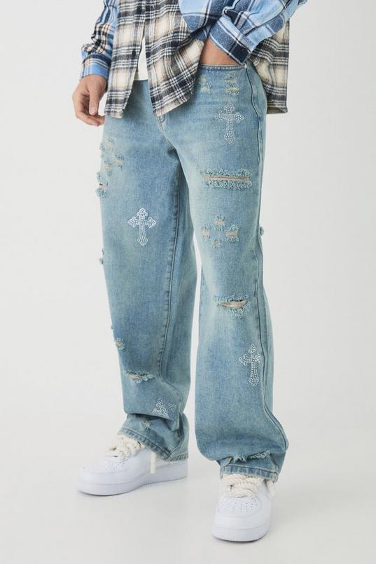 Relaxed Fit Rhinestone Cross Ripped Jeans by BOOHOOMAN