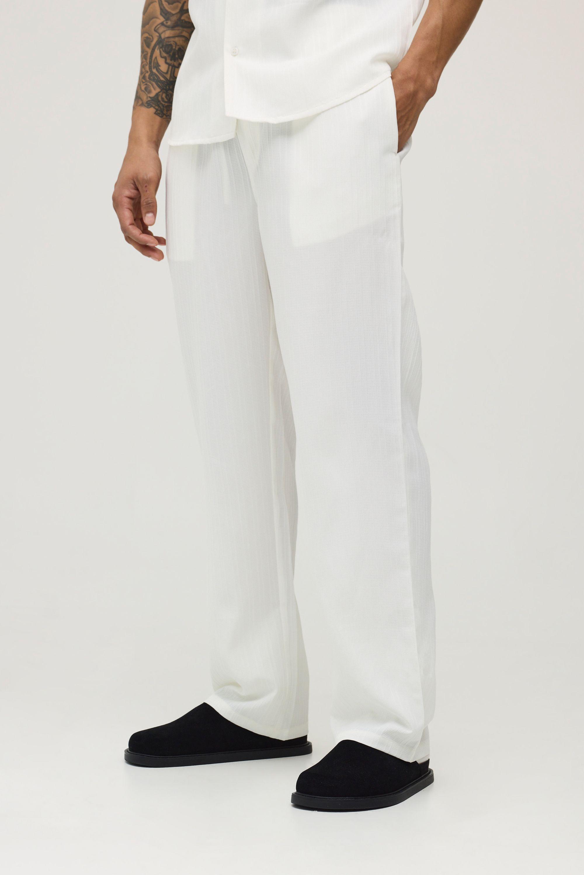 Textured Pleated Relaxed Fit Trousers by BOOHOOMAN