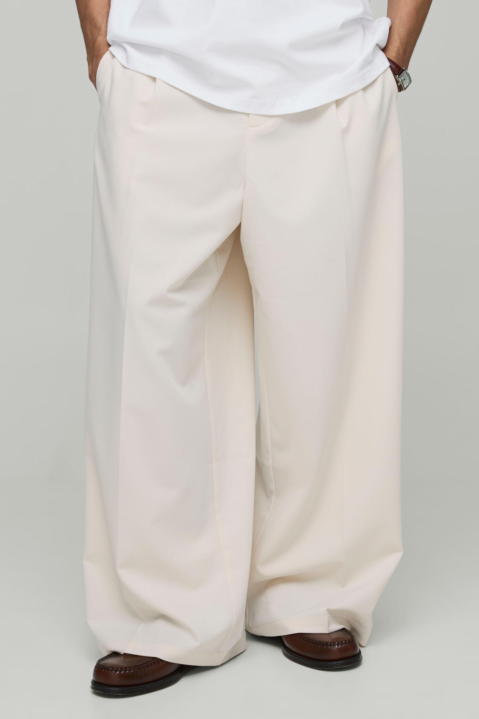 Wide Fit Pleat Front Tailored Smart Trousers by BOOHOOMAN