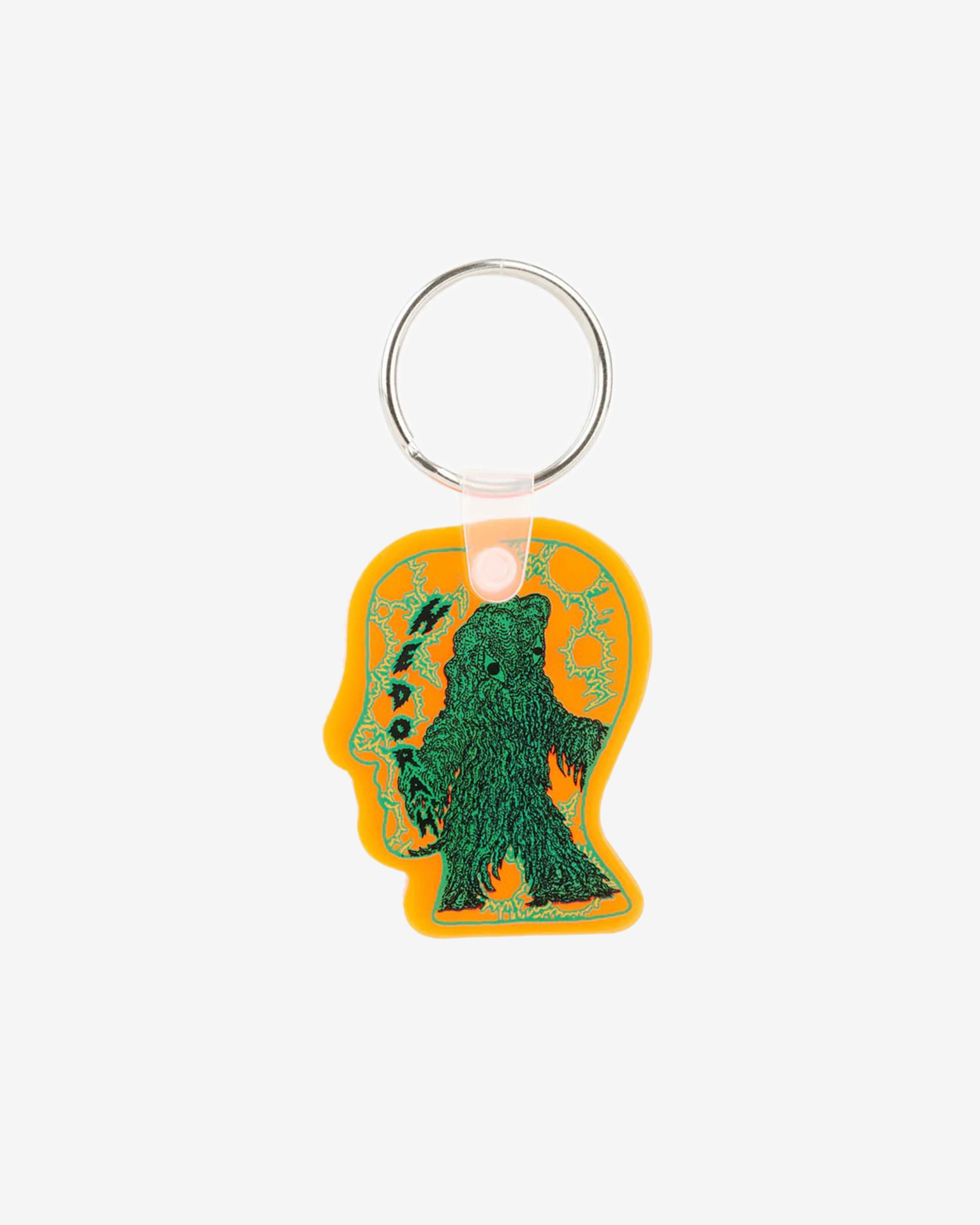 Brain Dead x Godzilla - Hedorah Logohead Keychain - (Clear Orange) by BRAIN DEAD