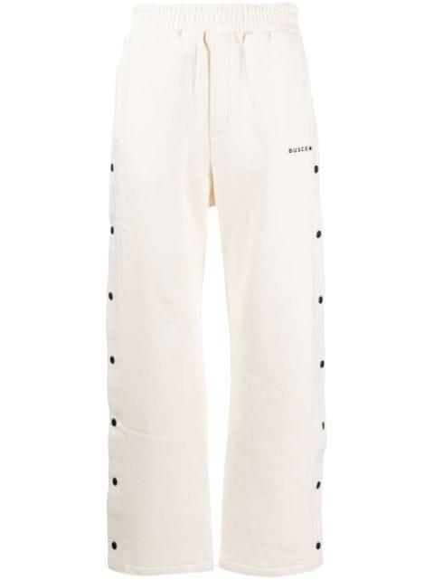 button-embellished track pants by BUSCEMI