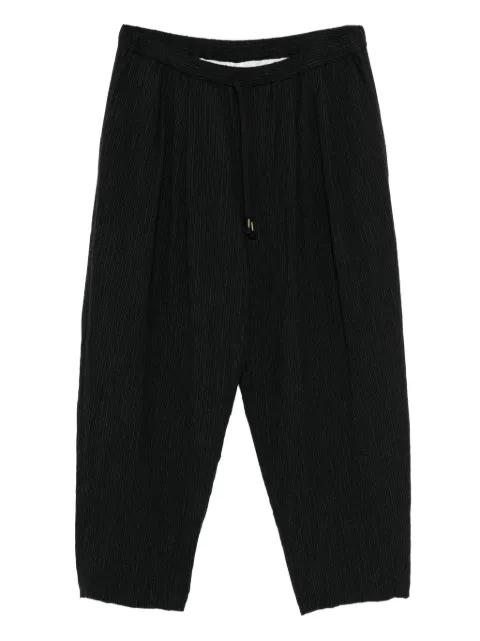 double pleated tapered trousers by CALMLENCE