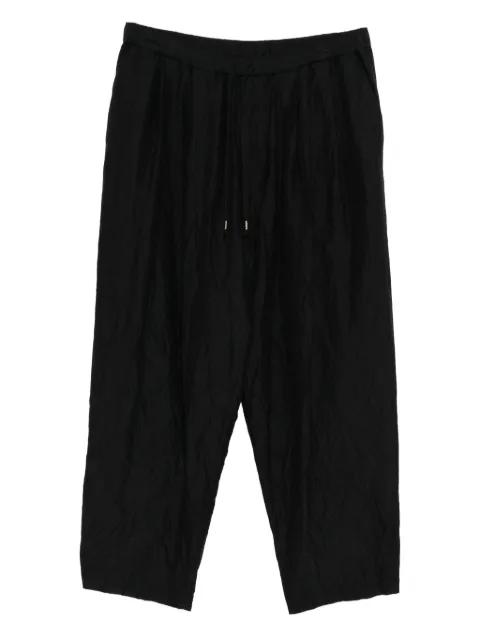 double pleated tapered trousers by CALMLENCE