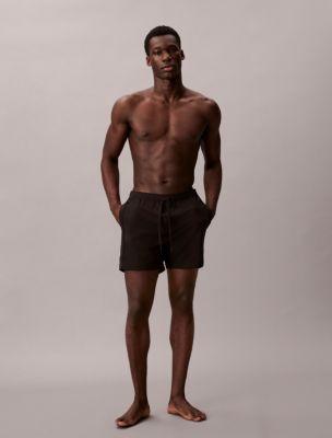 Core Solid Swim Shorts by CALVIN KLEIN