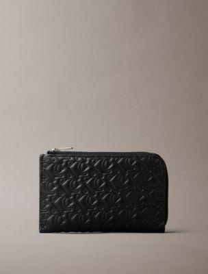 Embossed Allover Monogram Zip Wallet | Calvin Klein by CALVIN KLEIN