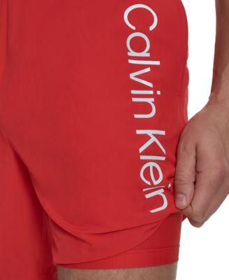Men's Regular-Fit Quick-Dry 7" Swim Trunks with Compression Short Liner by CALVIN KLEIN