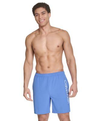 Men's Regular-Fit Quick-Dry 7" Swim Trunks with Compression Short Liner by CALVIN KLEIN
