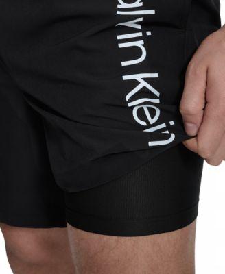 Men's Regular-Fit Quick-Dry 7" Swim Trunks with Compression Short Liner by CALVIN KLEIN