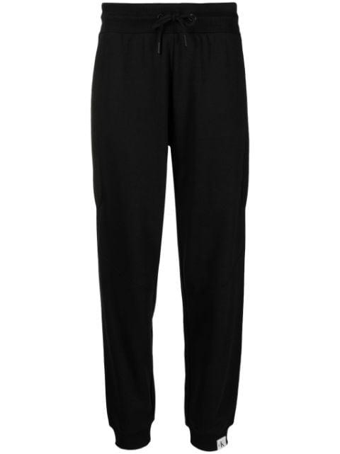 Tab jersey track pants by CALVIN KLEIN