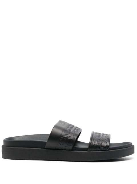 embossed-logo leather slides by CALVIN KLEIN