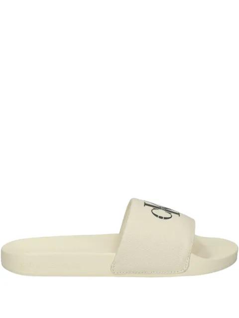 logo-embellished slides by CALVIN KLEIN