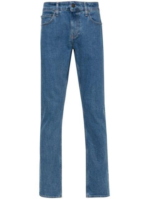 low-rise slim fit jeans by CALVIN KLEIN