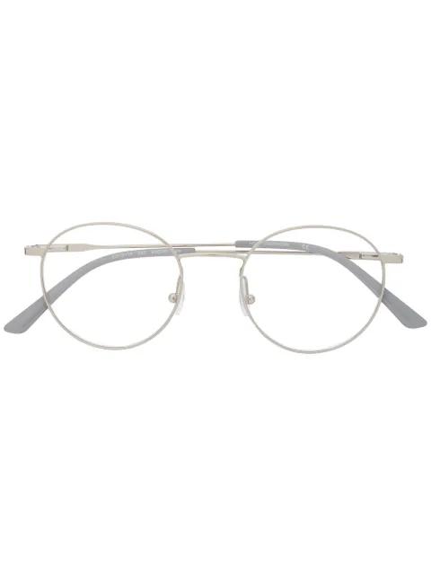 round-frame metal glasses by CALVIN KLEIN